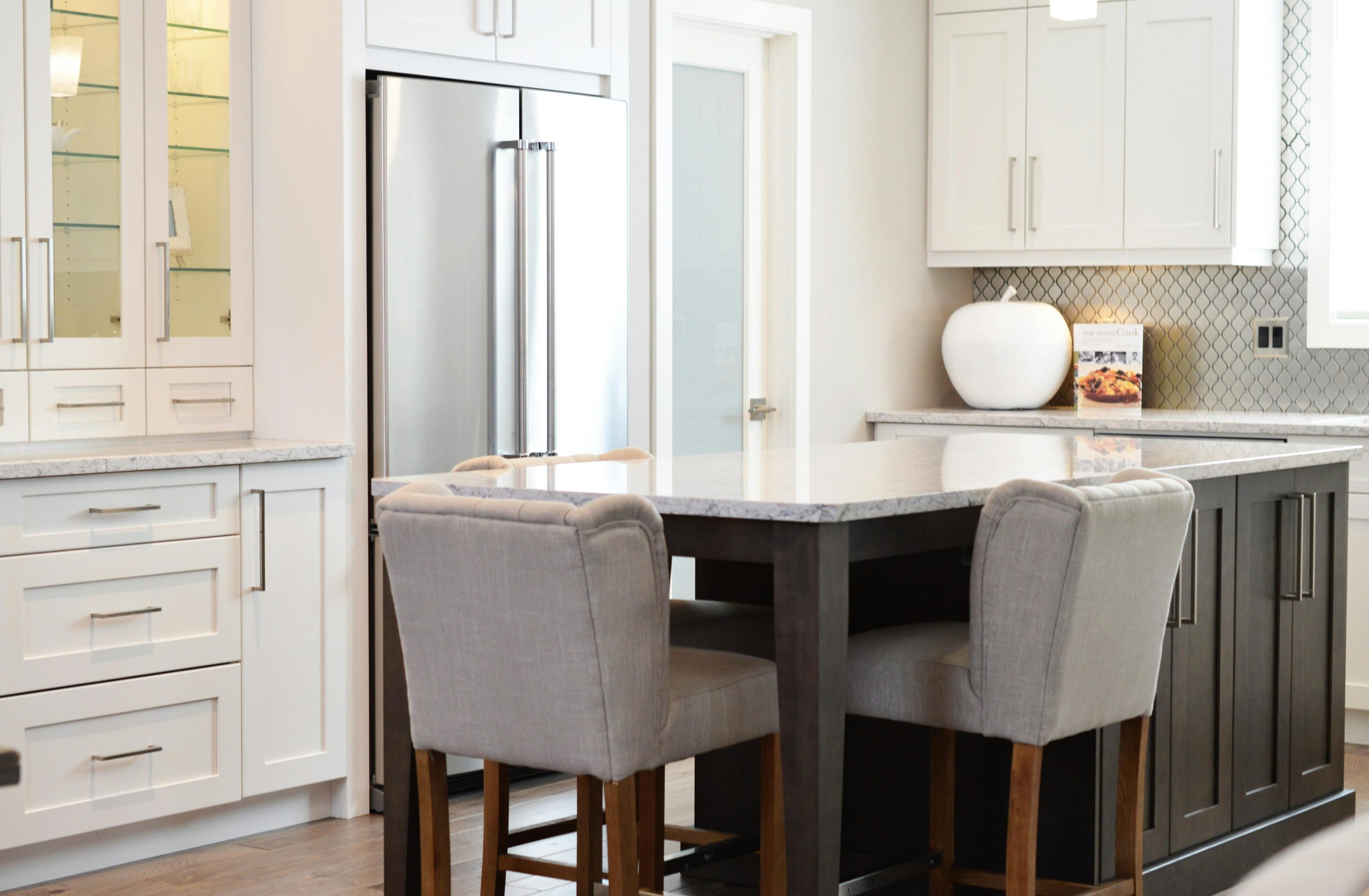 kitchen remodel with white cabinets and glass shelves