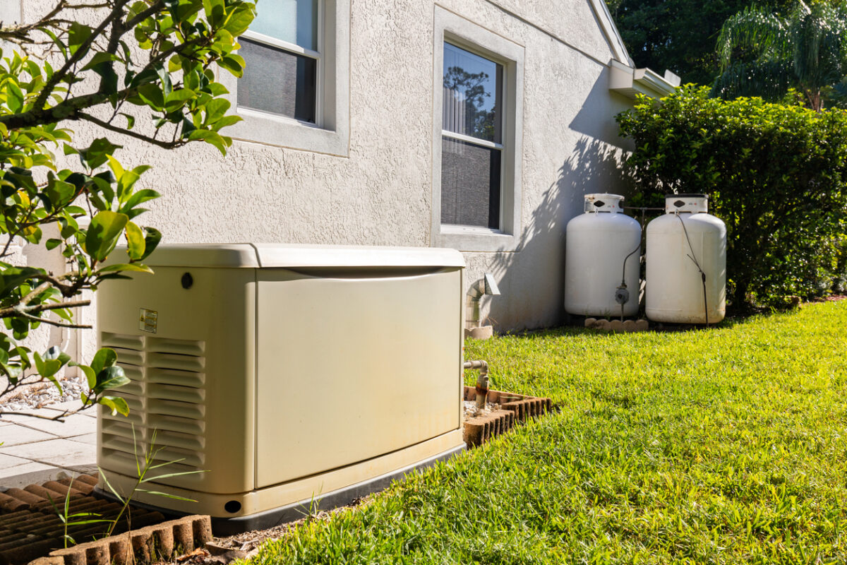 generator and propane tanks in the side yard