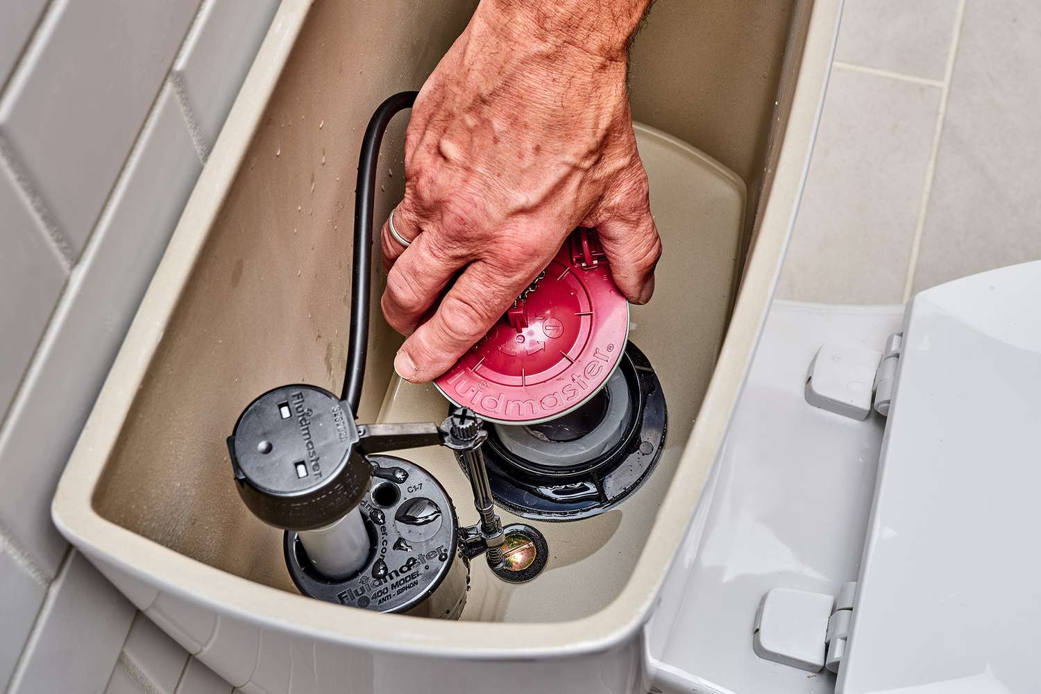 repairing leaking toilet