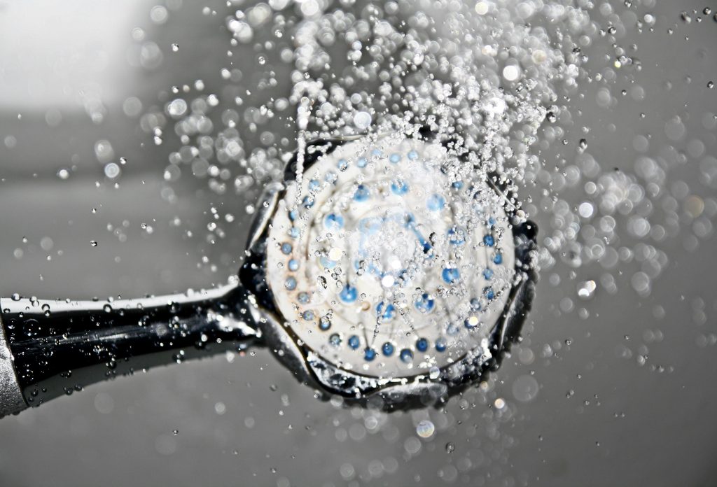shower head with water running
