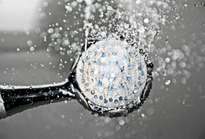 shower head with water running
