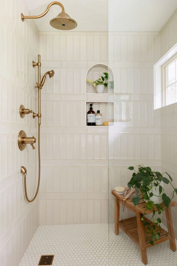 remodeled bathroom with new gold brushed plumbing
