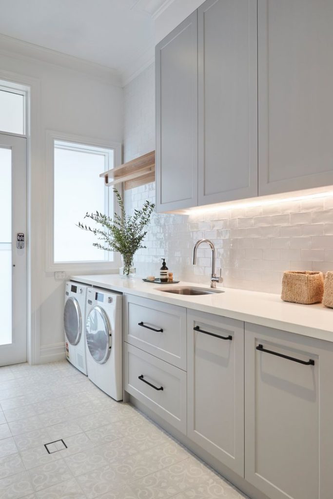 Bright laundry room with wash sink