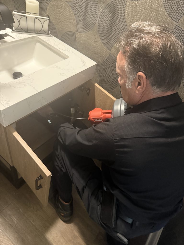 Morgan Plumbing fixing the drain